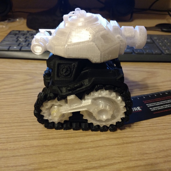 The side view of a 3D printed tank toy.